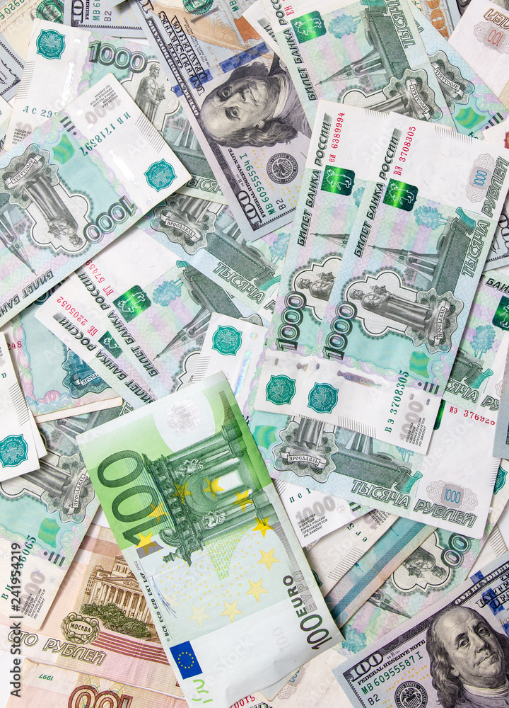 Dollars and Russian rubles. Euro on the table as background Dollars and Russian rubles. Euro on the table as background
