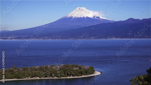 A VIEW OF MT. FUJI OVER THE OCEAN FROM OSEZAKI (NUMAZAKI) IN NUMAZU CITY, SHIZUOKA PREFECTURE, JAPAN. photo