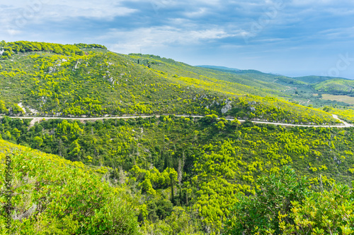 Greece, Zakynthos, Curved mountain road through green paradise like mountains and valleys