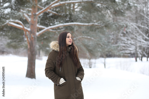 Beautiful girl in a beautiful winter park