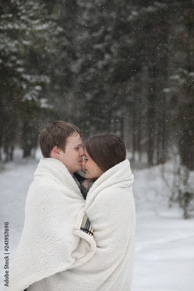 pair of lovers on a date winter afternoon in a snow blizzard pair of lovers on a date winter afternoon in a snow blizzard