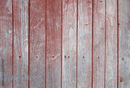 vertical row of faded red painted hardwood panel floor texture background