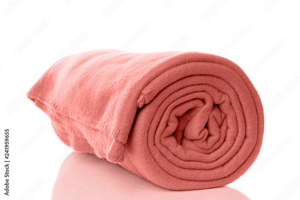 rolled up fleece blanket in living coral - color of the year 2019 - obrazy, fototapety, plakaty 