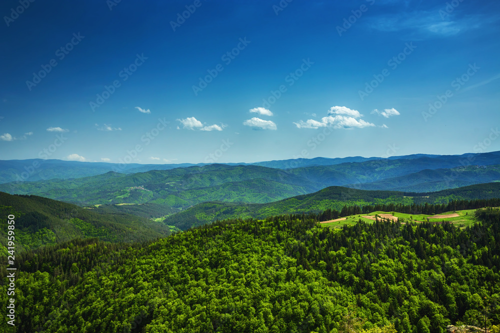 Beautiful mountain landscape, with mountain peaks covered with forest and a cloudy sky. Bulgarian mountain, Europe