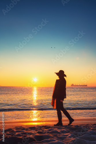Silhouette of carefree woman on the beach © ValentinValkov