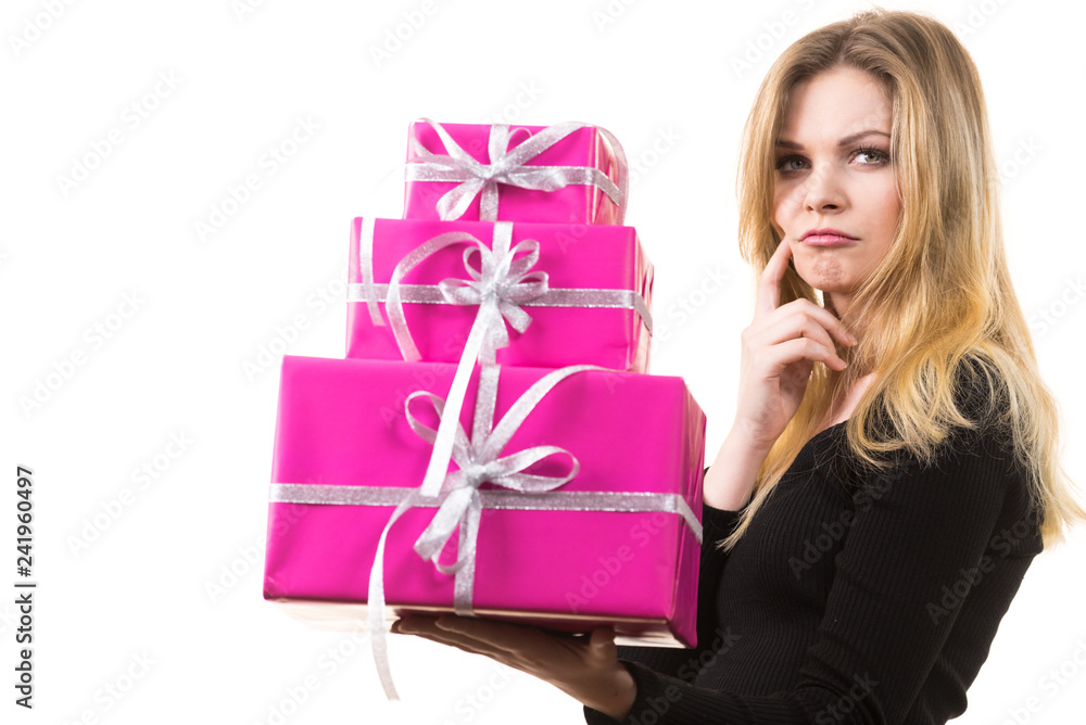 Thinking girl with pink gift boxes Thinking girl with pink gift boxes