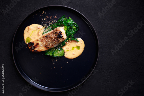 diet food, proper nutrition, seafood, vegetarian, pescetarian. grill pub and fish restaurant menu, delicious pikeperch with spinach garnishing and sauce, grilled zander