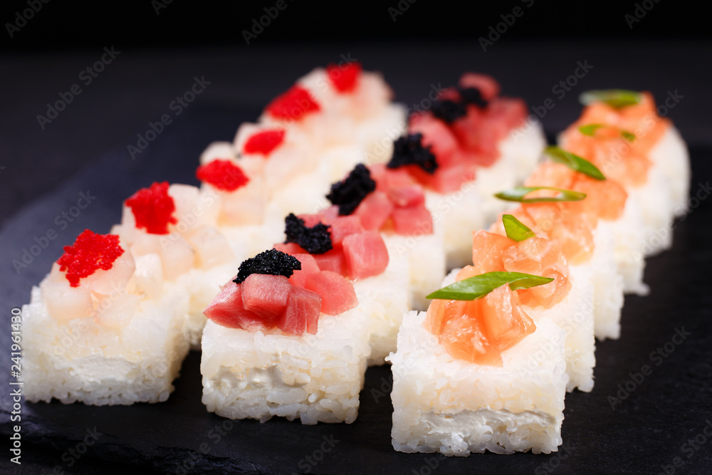 Delicious pressed sushi set with cream cheese, tuna, scallop and salmon, Japanese restaurant menu, delicacy, banquet 