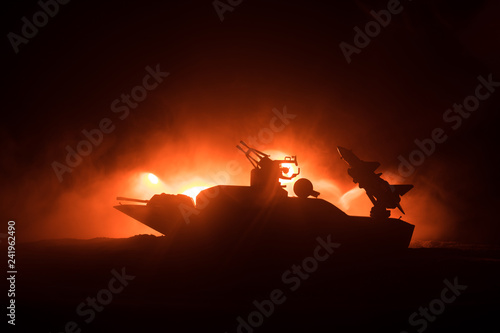 Sea battle scene. Silhouette of military war ship on dark foggy toned sky background. Explosion and fire. Dramatic scene decoration.