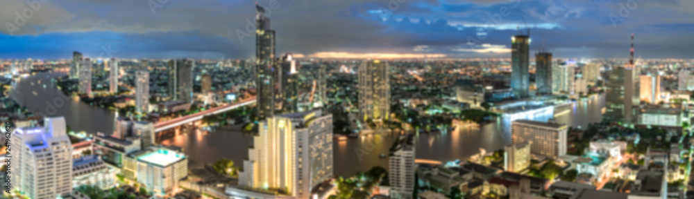 Fototapeta premium Bangkok city - Beautiful sunset curve Chao Phraya River panoramic Cityscape urban of Bangkok city at night , panorama landscape Thailand