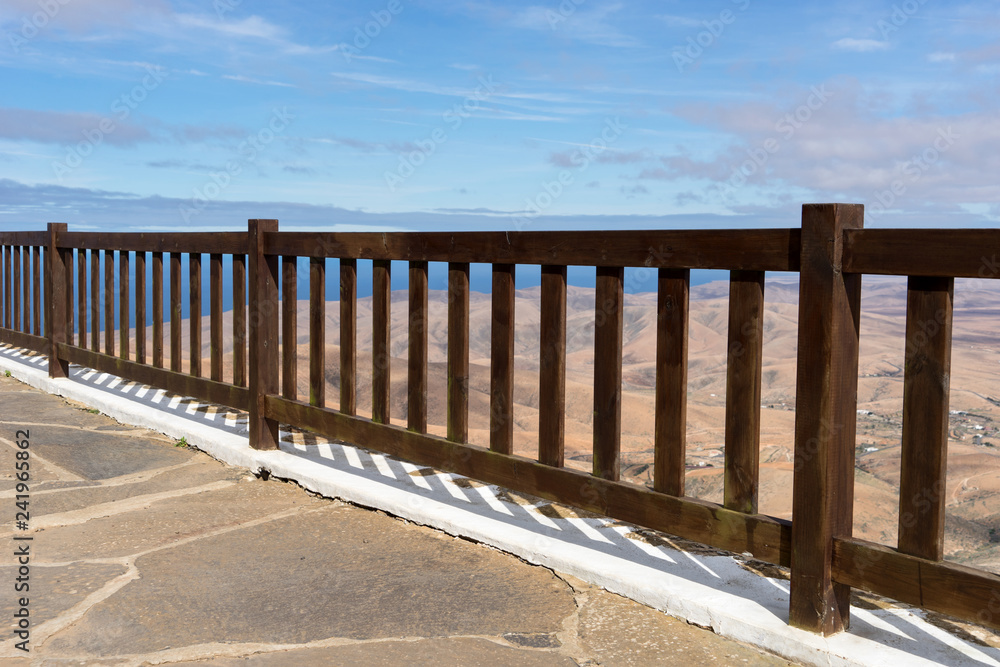 View through the fence on the mountains of Fuerteventura. Canary Islands. Spain View through the fence on the mountains of Fuerteventura. Canary Islands. Spain