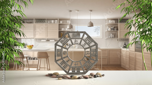 White table shelf with bagua, pebble stone and bamboo plants, modern white and wooden kitchen with island and stools, zen concept interior design, feng shui template idea background