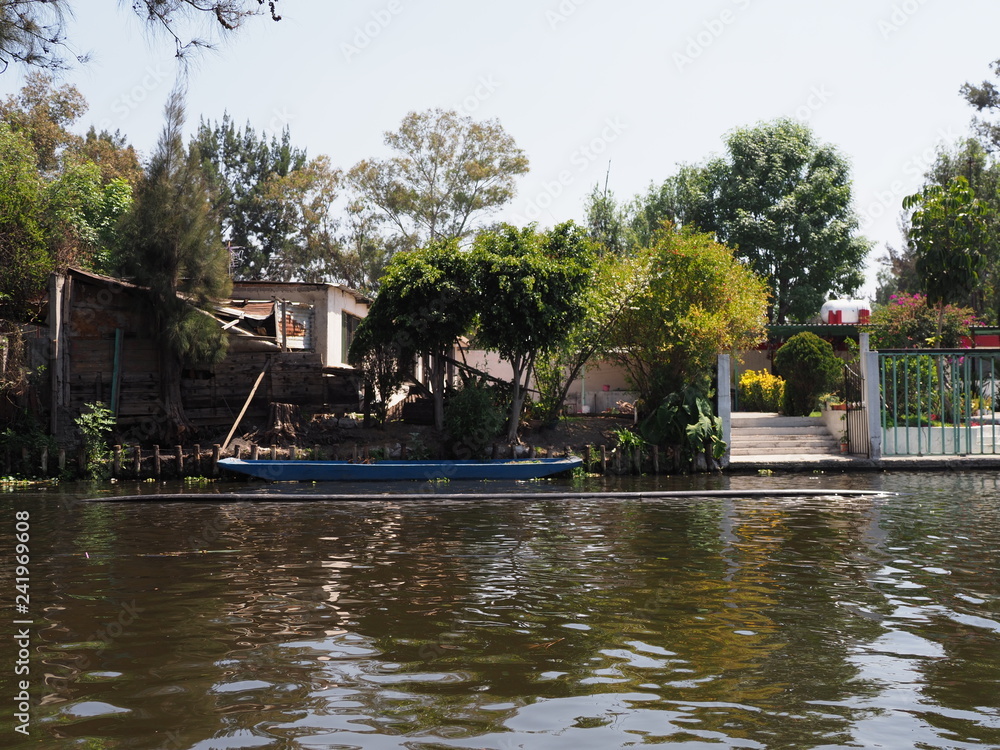 Blue boat at Xochimilco's Floating Gardens in Mexico