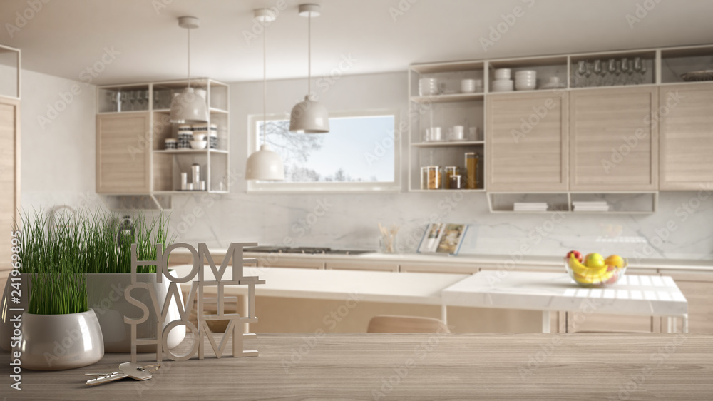 Wooden table, desk or shelf with potted grass plant, house keys and 3D letters home sweet home, over white and wooden kitchen, architecture interior design, copy space background Wooden table, desk or shelf with potted grass plant, house keys and 3D letters home sweet home, over white and wooden kitchen, architecture interior design, copy space background