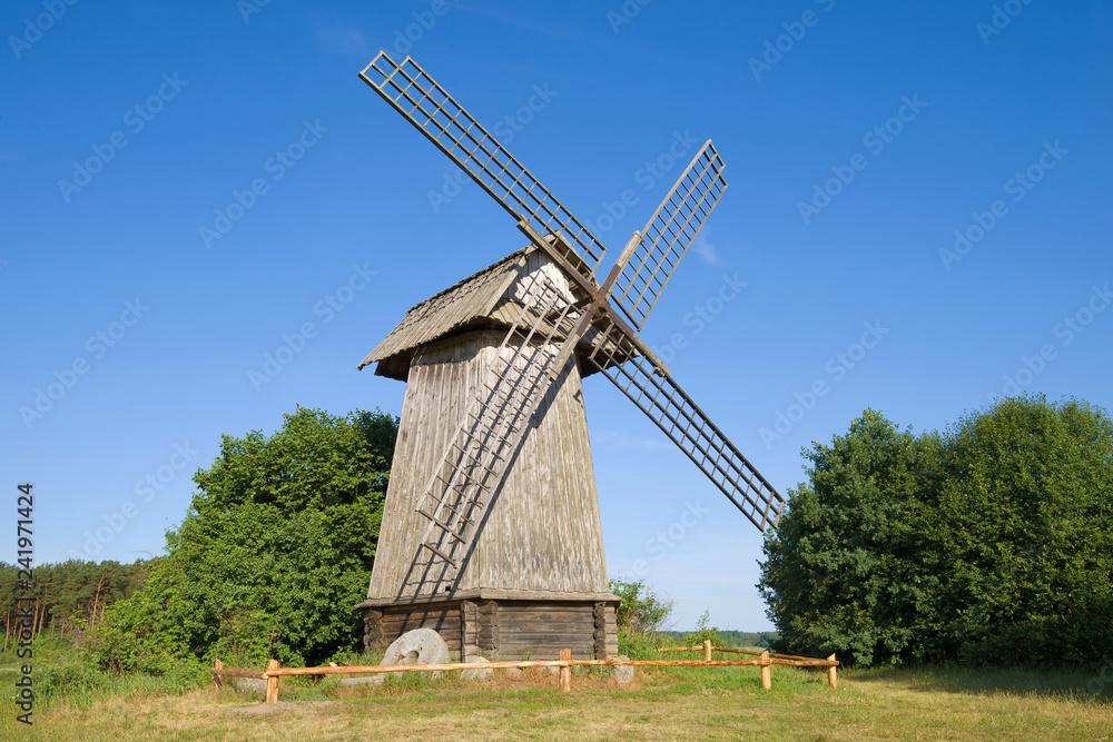 Old wooden windmill close-up on a sunny June afternoon. Mikhaylovskoye, Pskov region