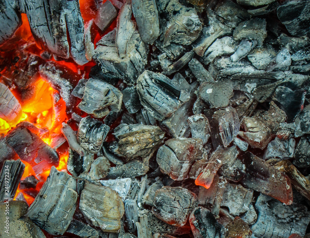 Burning coals, red hot charcoal grill. 