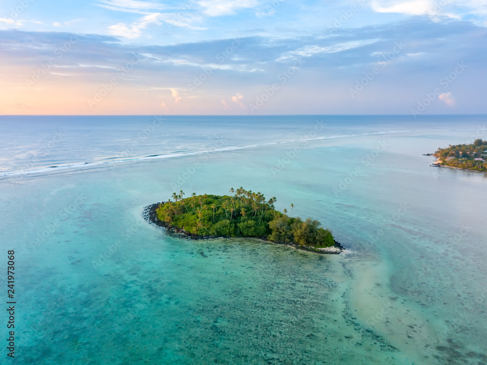 An aerial view of sunrise at Muri Lagoon on Rarotonga in the Cook Islands