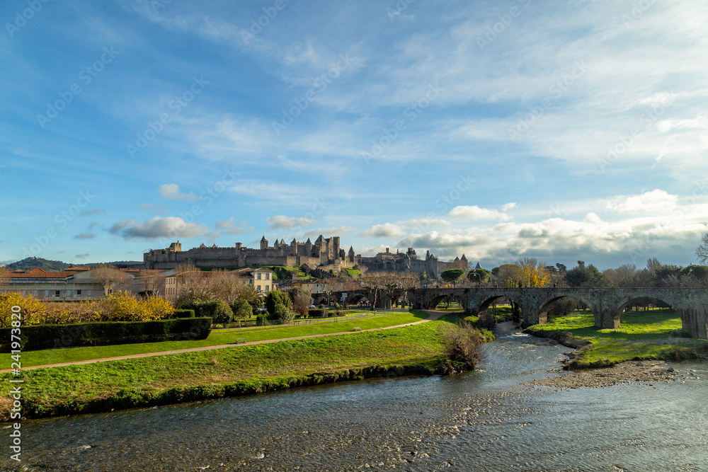 Cite de Carcassonne, medieval castle in Carcassonne, France and the Pont Vieux crossing the Aude river Cite de Carcassonne, medieval castle in Carcassonne, France and the Pont Vieux crossing the Aude river