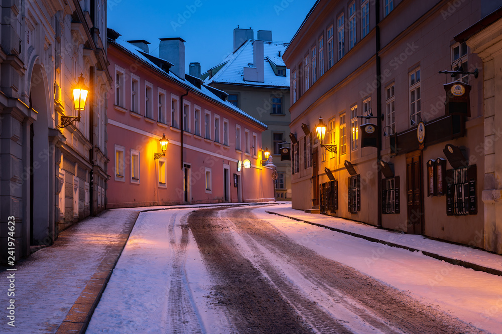 Empty street in winter Prague, Czech Republic. City covered with fresh snow.