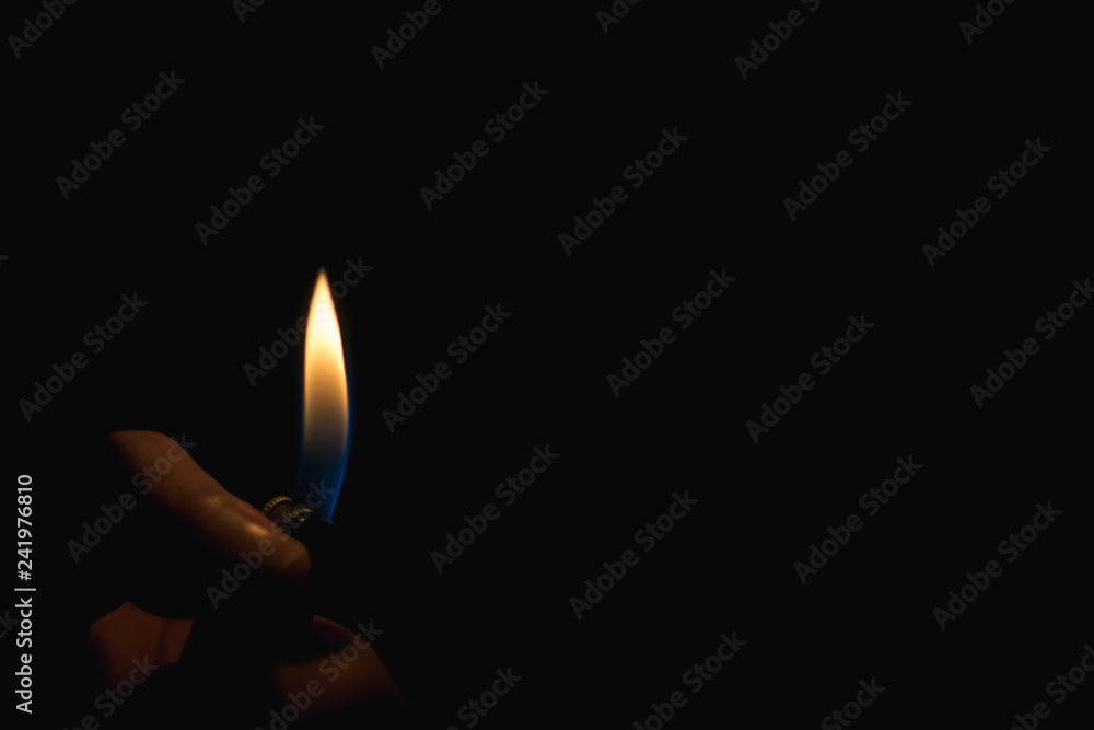 fire of lighter in the dark