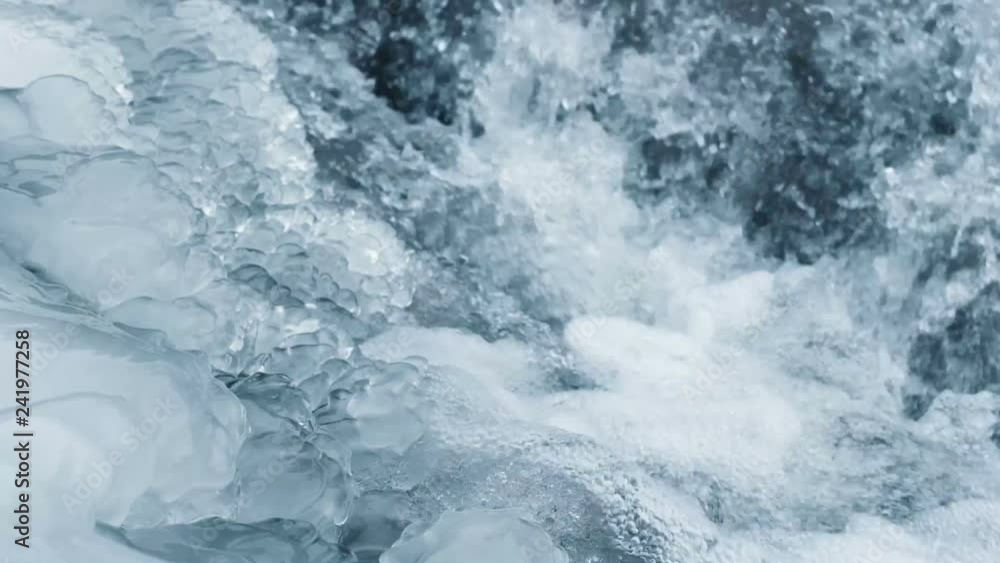 Crystal water with air bubbles and ice. Close up slow motion nature background footage. Crystal water with air bubbles and ice. Close up slow motion nature background footage.