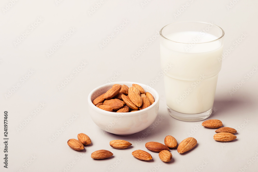 Almond non diary milk and nuts. Health care and diet concept Almond non diary milk and nuts. Health care and diet concept