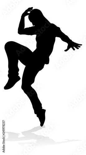 A male street dance hip hop dancer in silhouette