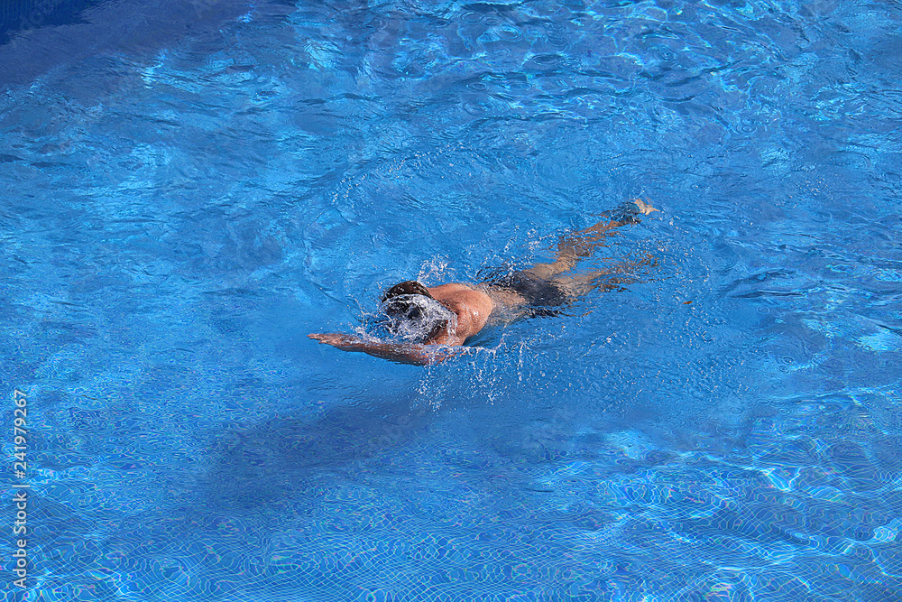 Swimmer doing the crawl in pool
