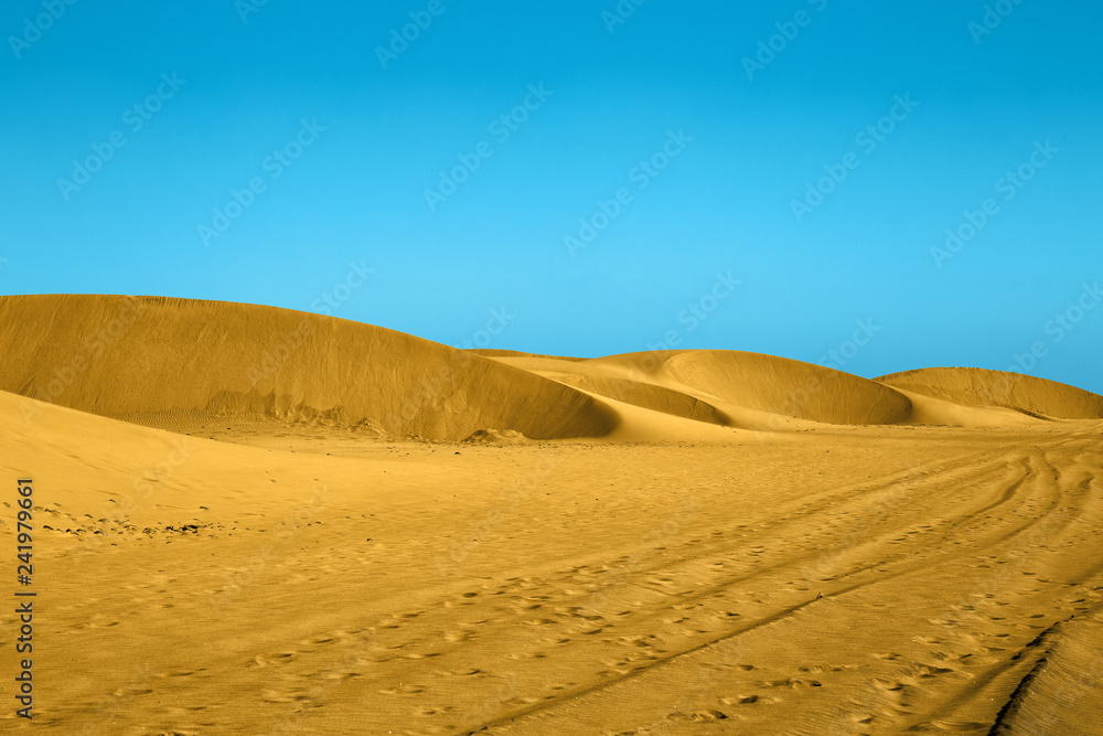 The Maspalomas Dunes, sand dunes on the south coast of the island of Gran Canaria, Province of Las Palmas, in the Canary Islands, Playa del Ingles. The Maspalomas Dunes, sand dunes on the south coast of the island of Gran Canaria, Province of Las Palmas, in the Canary Islands, Playa del Ingles.