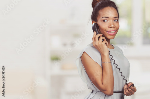 Casual businesswoman using phone