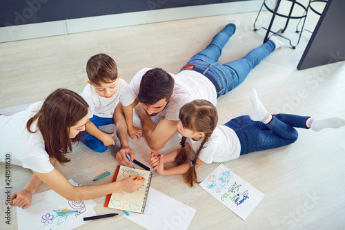 Top view of family drawing on the floor