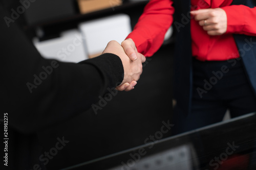 Business people shake hands at a meeting in a stylish office