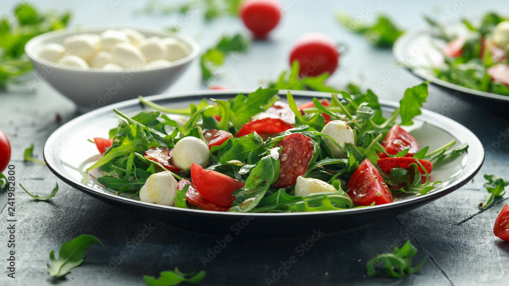 Chorizo salad with cherry tomatoes, mozzarella and wild rucola Chorizo salad with cherry tomatoes, mozzarella and wild rucola