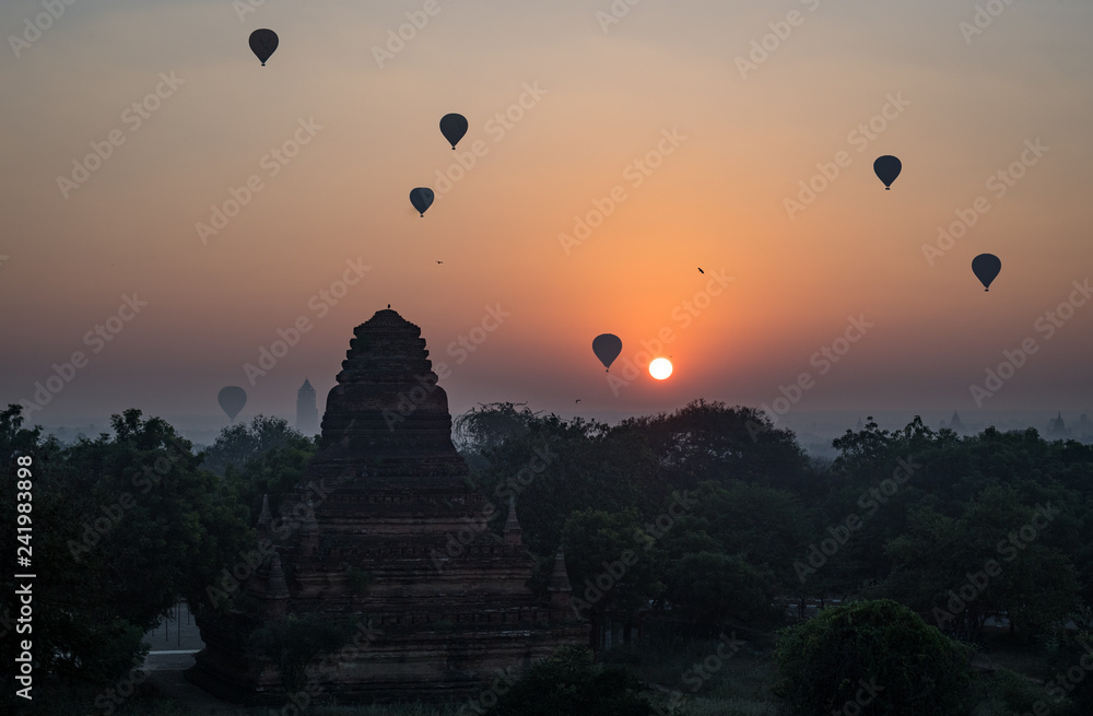 Hot air balloons fill the dawn sky in Bagan, Myanmar