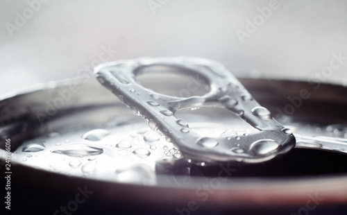 aluminum can for carbonated drinks is opened with a key-opener