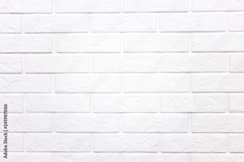 Obraz premium White wall of light brick, background with white brick.