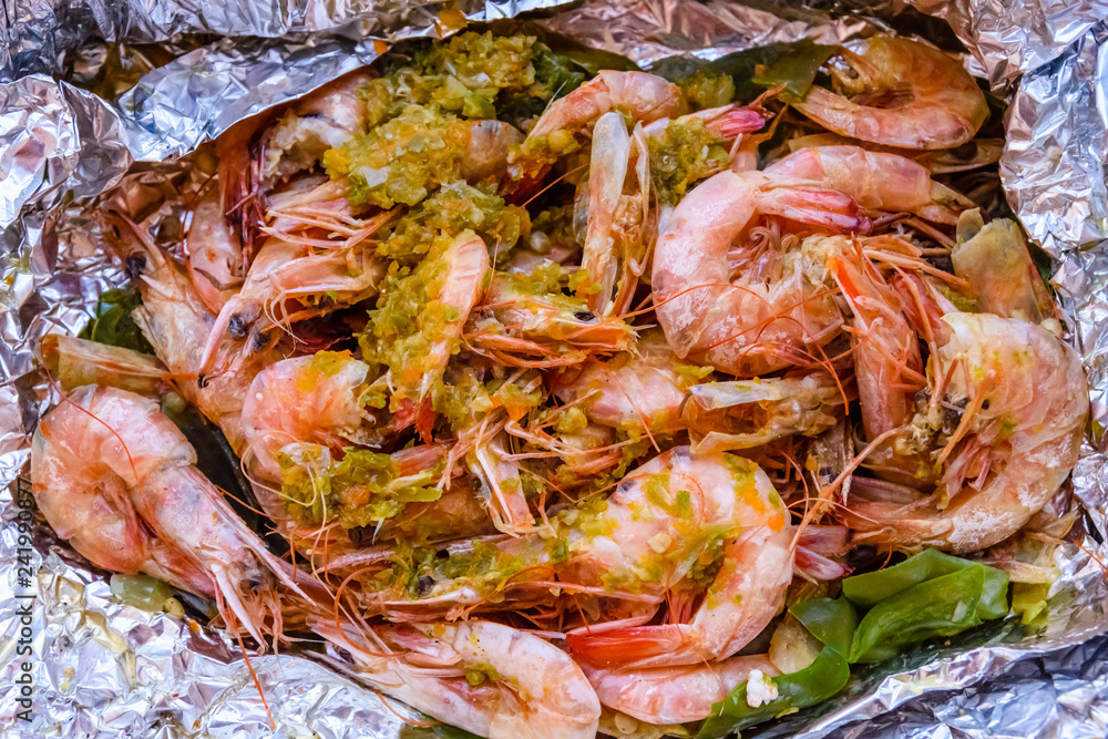 Fresh baked king shrimps with the oriental herbs