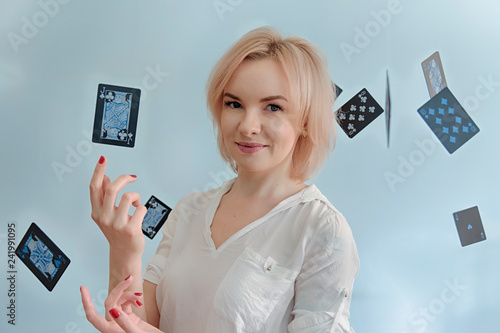 Canvas Print Portrait of magician or witch or fortune-teller pretty blonde woman staying insi