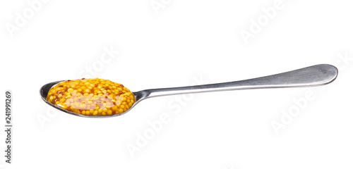 Mustard sauce, wholegrain mustard in small metal spoon  isolated on white background,