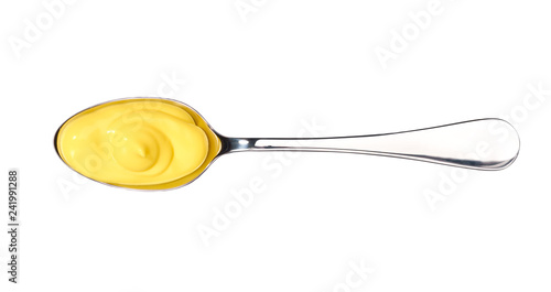 Cheese sauce in small metal spoon  isolated on white background,top view