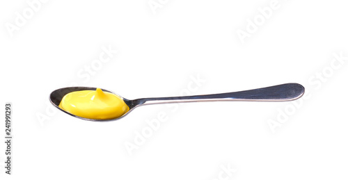 Cheese sauce in small metal spoon isolated on white background,