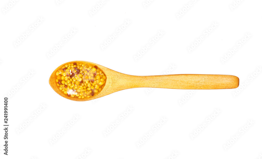 Mustard sauce in small wooden spoon isolated on white background,top view Mustard sauce in small wooden spoon isolated on white background,top view