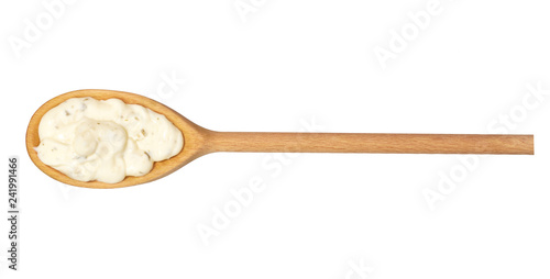 Tartar sauce in wooden spoon isolated on white background,top view