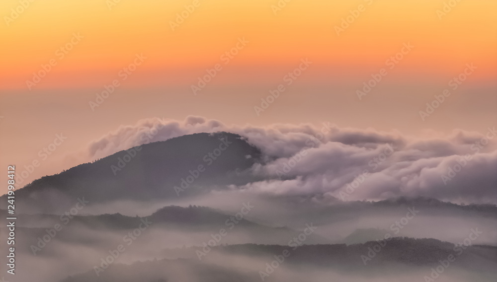 sunrise at Doi Inthanon National Park, mountain view morning of Doi Hua Suea around with the ocean of mist with colorful sun light in the sky background, Kew Mae Pan View Point, Chiang Mai, Thailand. sunrise at Doi Inthanon National Park, mountain view morning of Doi Hua Suea around with the ocean of mist with colorful sun light in the sky background, Kew Mae Pan View Point, Chiang Mai, Thailand.