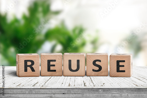 Reuse sign on a wooden table in a room photo