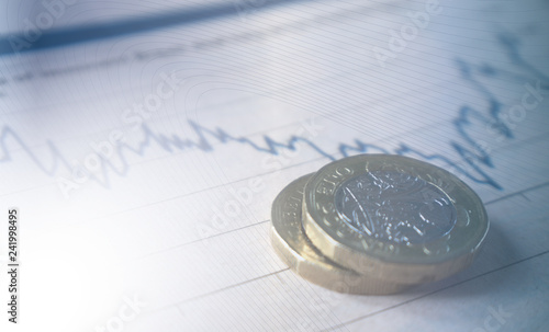 Financial business coins on stock graph photo