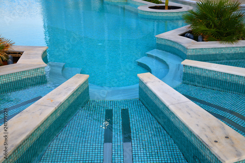 Descent to the pool made in shape of a semicircle photo