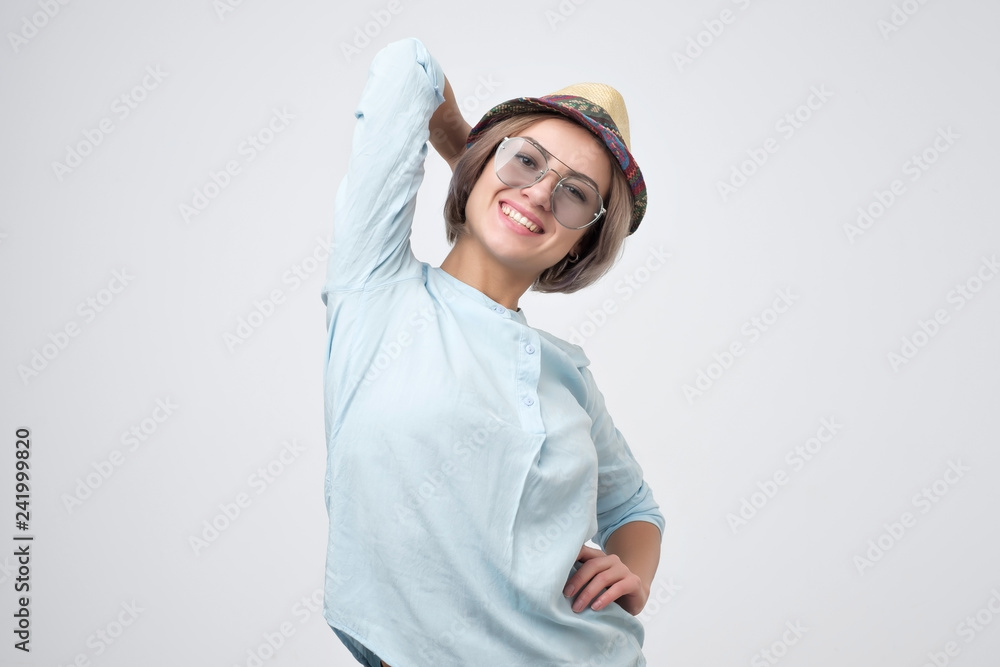 Casual young woman standing against white background. Casual young woman standing against white background.