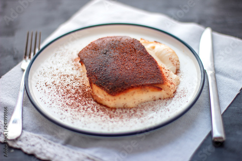 Traditional Turkish dessert Kazandibi with ground cinnamon photo