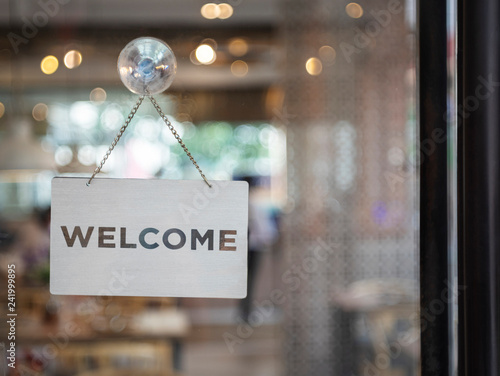 Welcome sign outside a restaurant, store, office or other photo